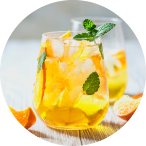 Glass of Choice Organics Iced Tea with Orange and Mint Infused Water